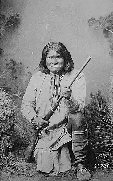 Geronimo (Goyathlay), a Chiricahua Apache Kneeling with Rifle, 1887.