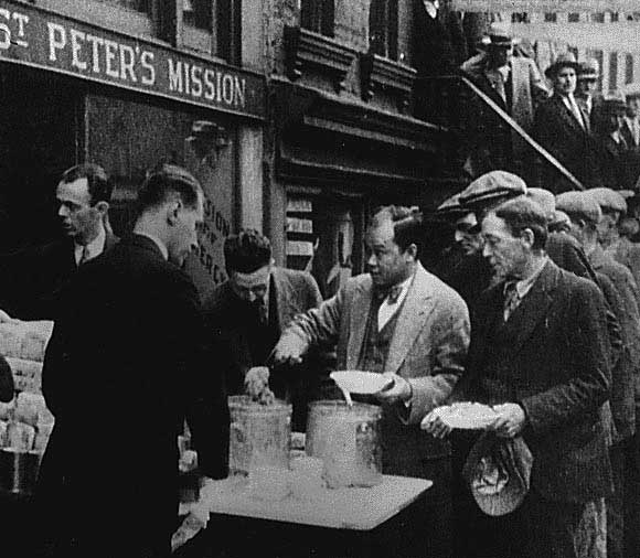 Depression Breadlines; long line of people waiting to be fed, New York City, 1932.