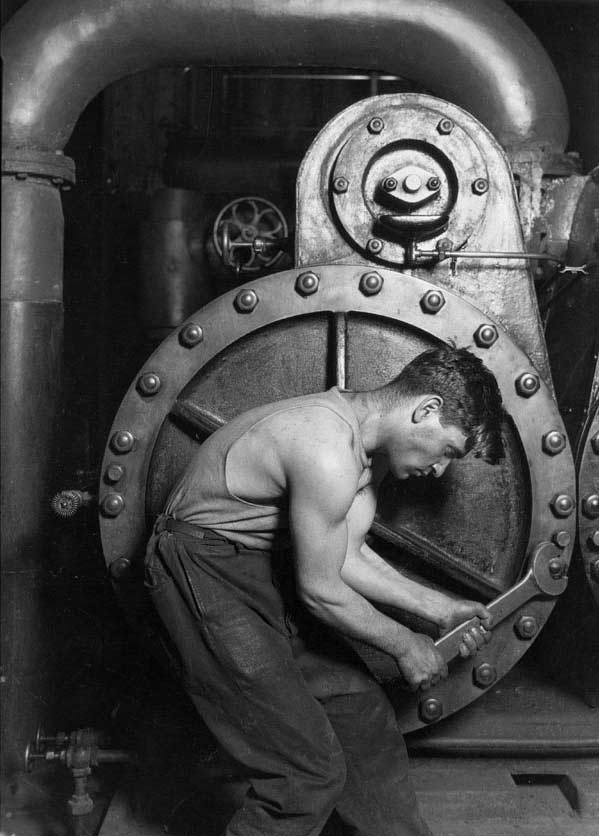 Powerhouse Mechanic Working on Steam Pump, 1920.