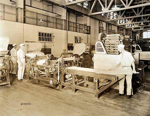 Manufacturing processes of hard bread at the National Biscuit Company plant in New York.