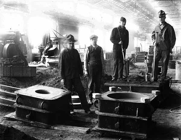 Men Working at Mould, Circa 1919.